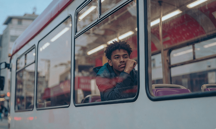 Introvert Kid sitting upset in a bus, thinking deeper